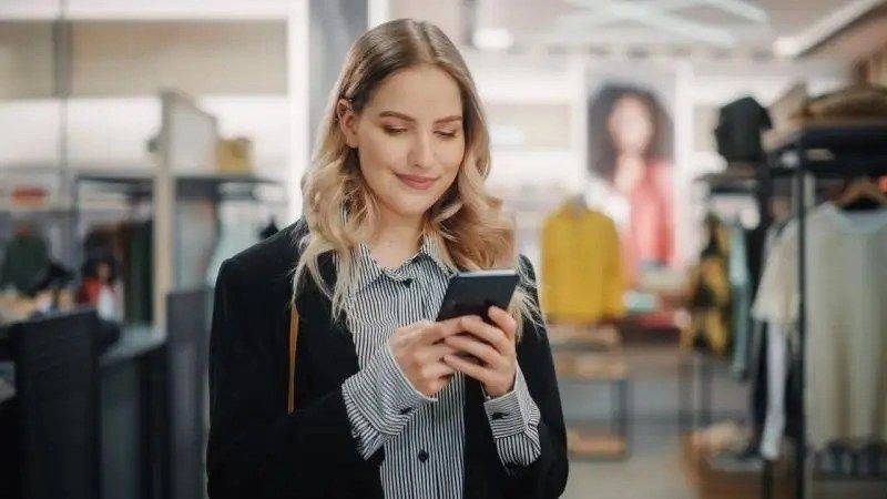 a woman holding a phone