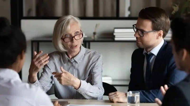 Female business leader speaking at meeting