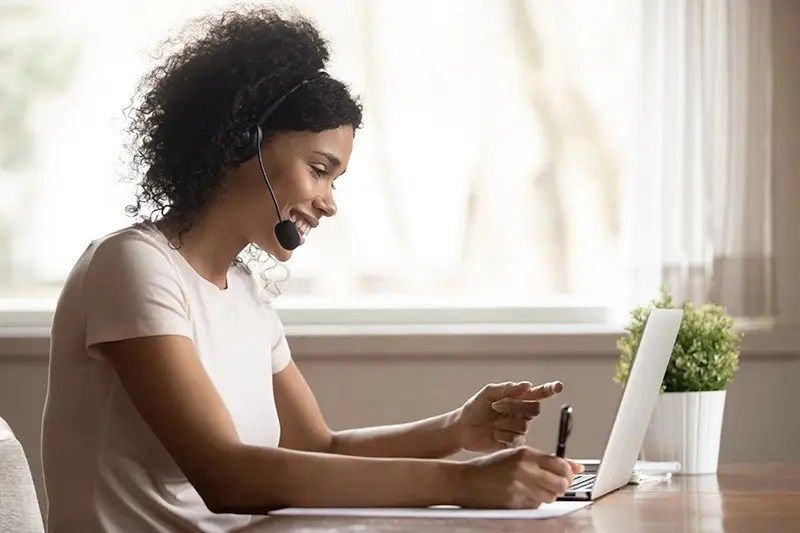 smiling student with headphones