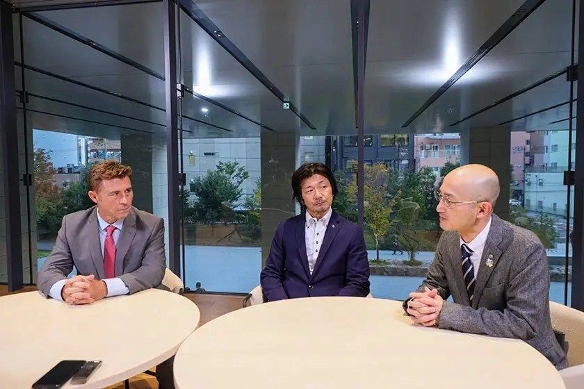 a few business people sitting at a table