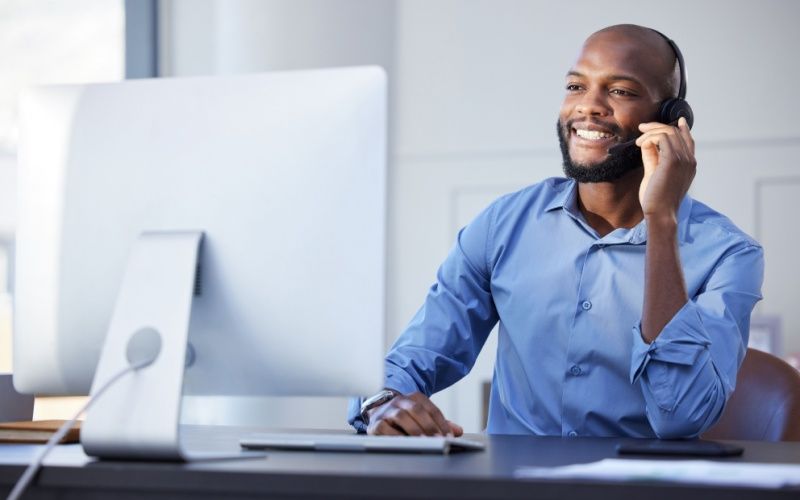 Call center agent talking to his customer