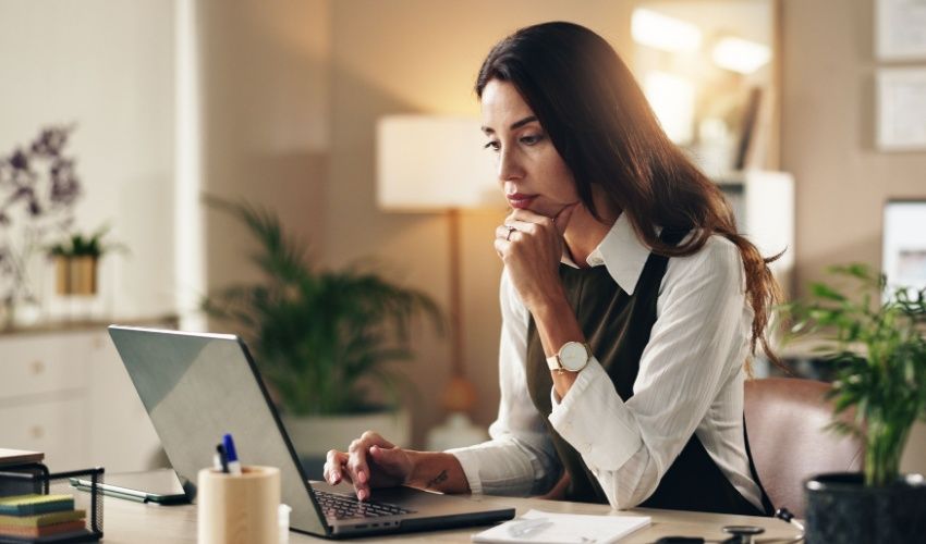 Woman, doctor or thinking in office with laptop