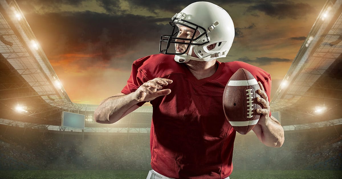 NFL athletes preparing to pass the football symbolizing dedication like NiCE’s customer service solutions.